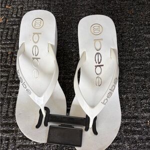 bebe White Patent Thong Sandals with Logo